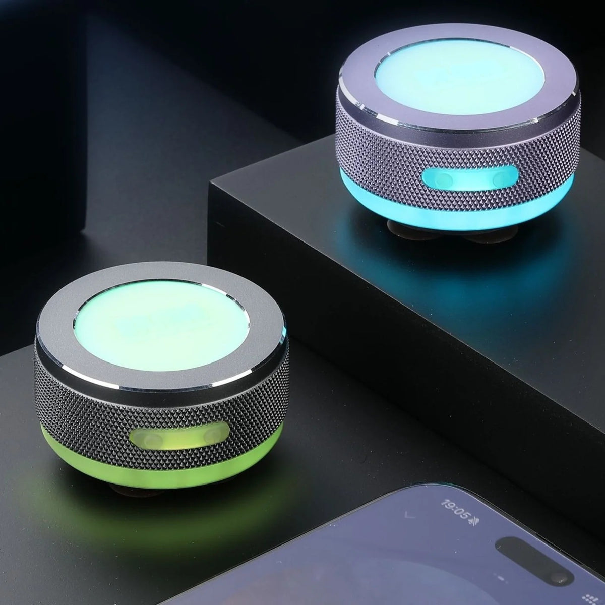 SONVEX Pulse Mini Surface Speaker with a glowing LED ring, two units on a dark desk