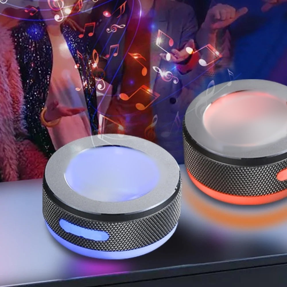 Two SONVEX Pulse speakers glowing with colored LED light in a lively setting